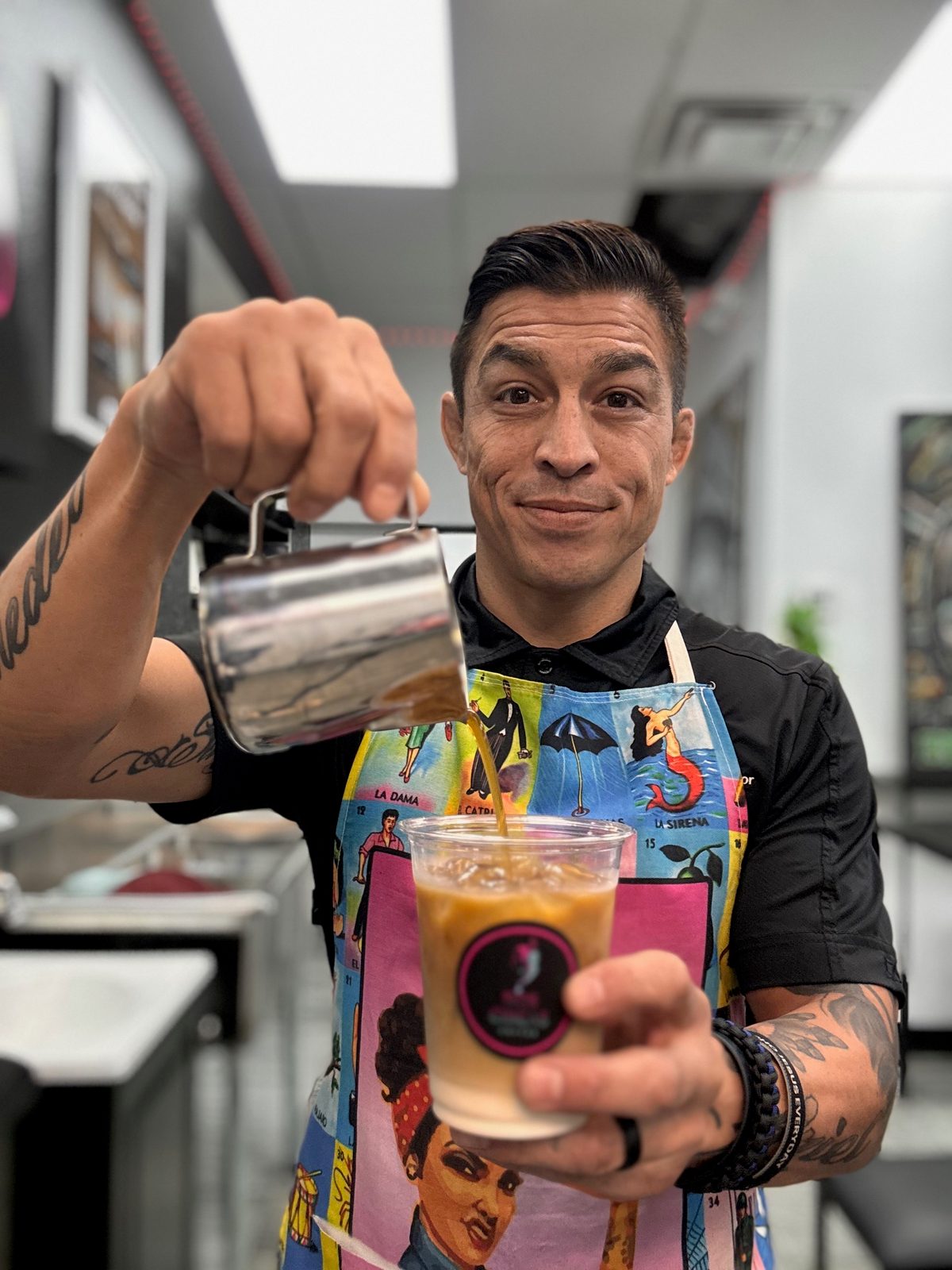 Riviera barista pouring a fresh iced coffee